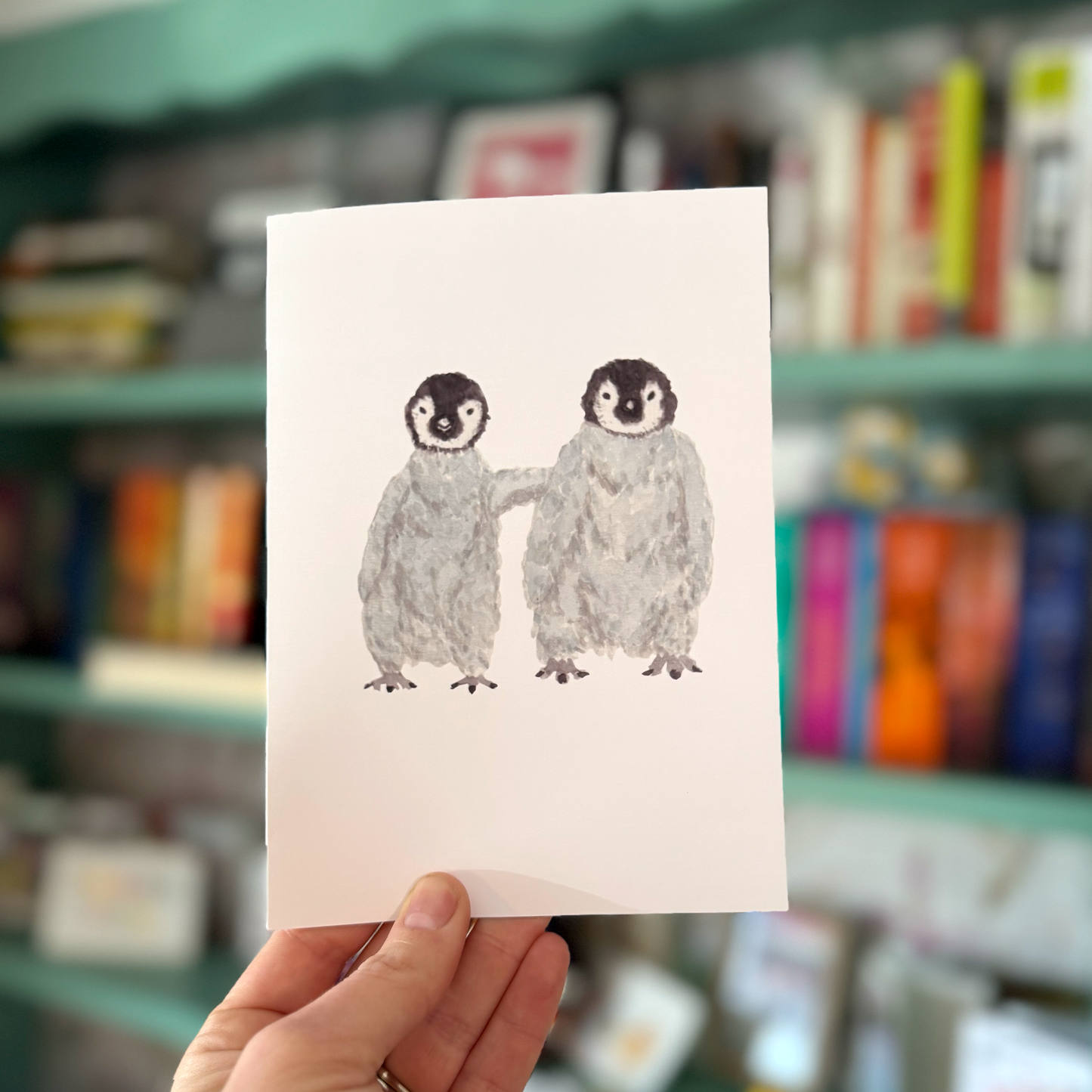 Cozy Penguins Greeting Card